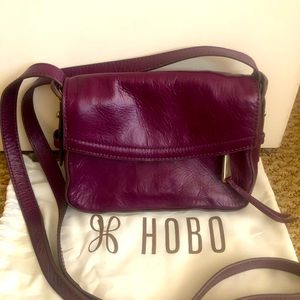 Small Eggplant colored leather HOBO brand crossbody purse.